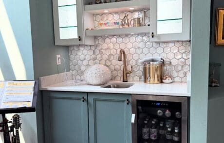 Living room bar area with wine refrigerator and custom cabinets in Hudson, Ohio by Summit County Remodeling