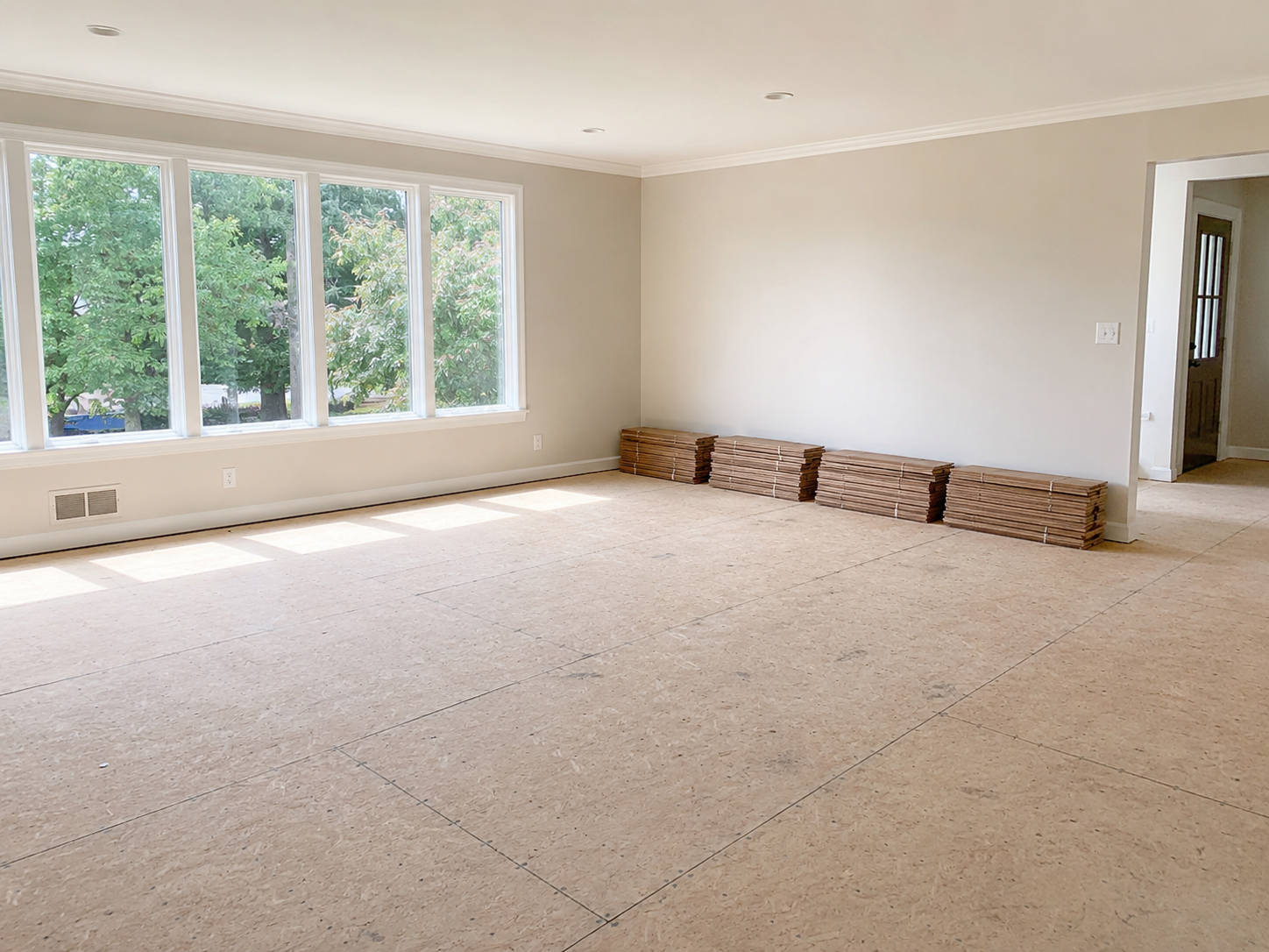 A room prepped for new hardwood flooring installation